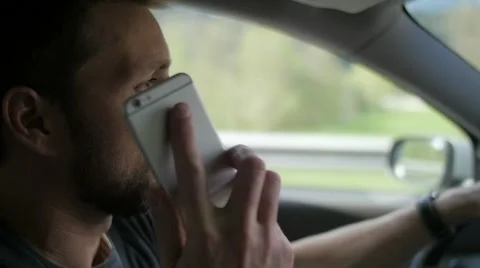 Slow motion of a man driving answering phone 스톡 동영상 49752023