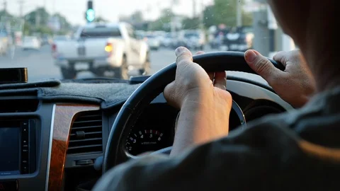 Slow motion, man hand control steering wheel driving car turn right on crossroad Stock Footage 89782056
