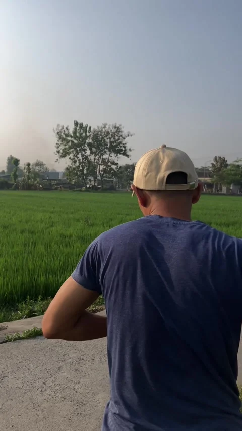 Slow Motion Of Man With Hat Doing Dumble Hook At Ricefarm Stock Footage 340978608