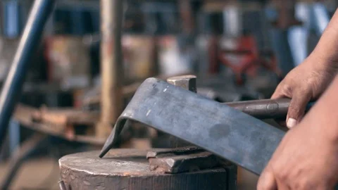 Slow motion of a man hitting the iron with a sledgehammer Stock Footage 86127801
