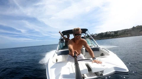 Slow motion man holding camera on boat Stock Footage 101569333