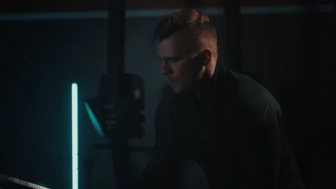 Slow motion a man holds a hammer in his hands and hit during a workout in gym Stock Footage 194045705