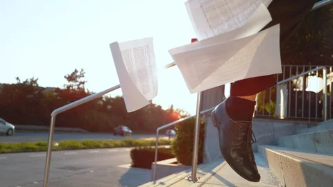 SLOW MOTION: Man in a hurry losing documents while rushing to get to a meeting. Stock Footage 101332049