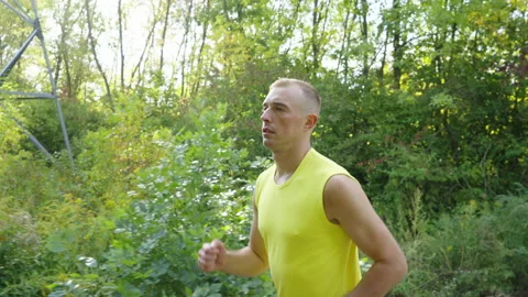 Slow motion man jogging in nature Stock Footage 162467398
