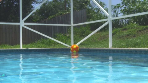 Slow motion of a man jumping inside a swimming pool Stock Footage 113938682