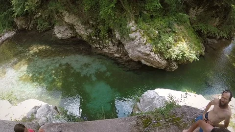 Slow motion of man jumping from rock into river, Slovenia. Stock Footage 97111968