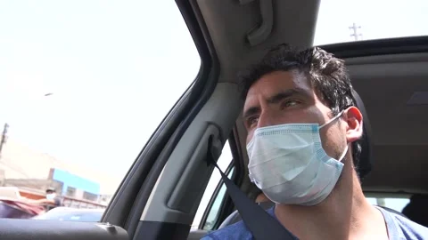 Slow motion of a man looking at the street through the passenger window Stock Footage 150917671