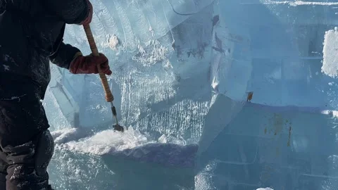 Slow motion. a man makes a product out of ice. A man cleans the ice.  Stock Footage 273372887