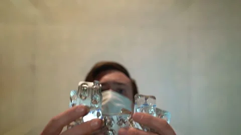 Slow motion man in the mask throws the on the table empty blister packs Stock-Footage 130198158