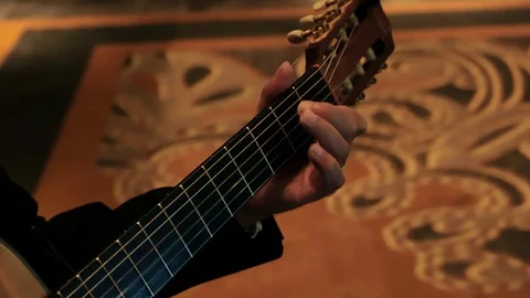 Slow motion man playing guitar fingers on neck close 스톡 동영상 112767804