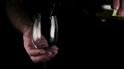 Slow motion. A man pours wine into a glass Stock-Footage 76018022