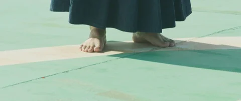 Slow motion of man practising kendo with wooden katana sword on roof, Tokyo Stock Footage 136121975