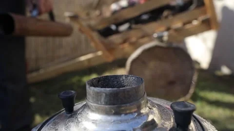 Slow Motion Man puts Coal to Metal Samovar Stock Footage 239329326