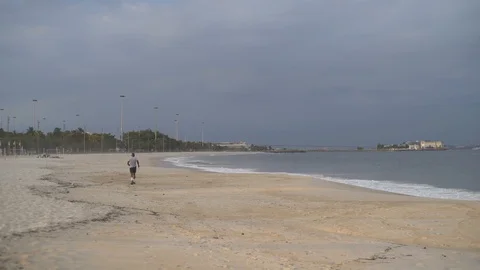 Slow Motion of Man Running on Copacabana Beach in Rio de Janeiro, COVID-19 Stock Footage 128337394
