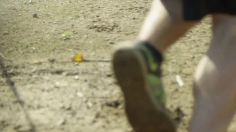 Slow motion man running in dirt path Stock Footage 70573896