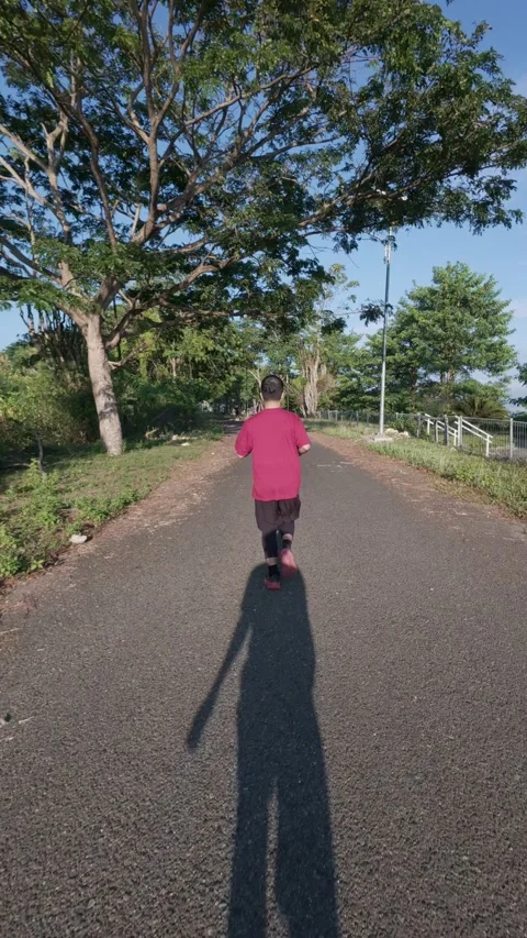Slow Motion of Man Running on Road Stock Footage 334908008