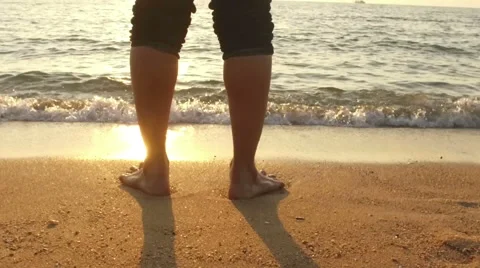 SLOW MOTION: man running in shallow sea at sunset 1920x1080 Stock Footage 58287149