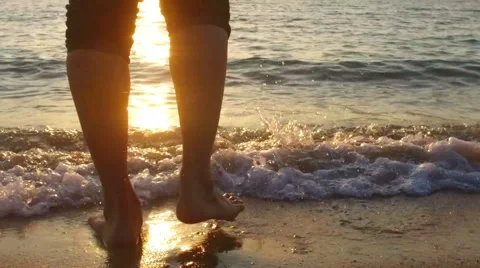 SLOW MOTION: man running in shallow sea at sunset 1920x1080 Stock Footage 58297949