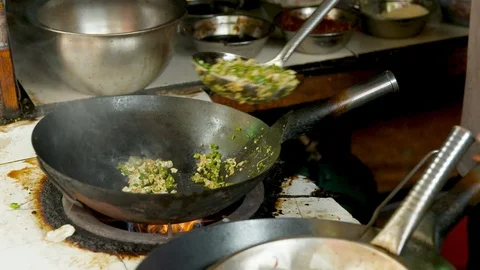 Slow Motion Man Serving Fried Rice and Cleaning the Pan Stock Footage 120529040