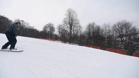 Slow Motion of Man Skiing Downhill 動画素材 103757412