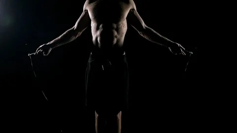 Slow motion of man skipping rope. Stock Footage 92154696