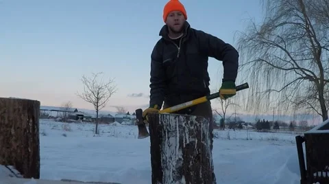 Slow motion man splits wood Stock Footage 59081468