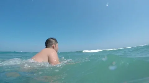 Slow-motion of man swimming front crawl in waves of Alboran sea Stock Footage 75408968