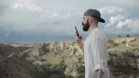 Slow Motion of Man Talking On His Smartphone in Matera. Italy Vídeo Stock 167139924