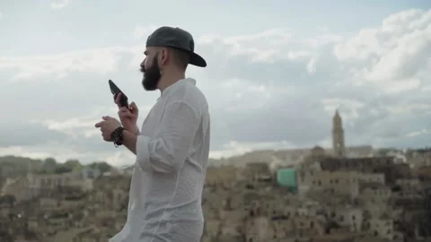 Slow Motion of Man Talking On His Smartphone in Matera. Italy Video stock 167140008