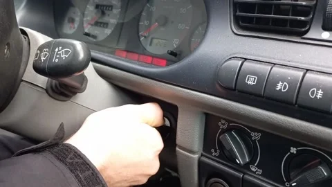 Slow motion of a man turning a car ignition key Stock-Footage 177401236