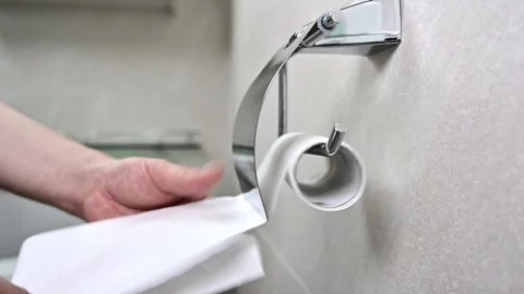 Slow motion. Man uses a roll of toilet paper in the toilet. close up. Stock Footage 133304797