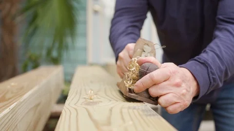 Slow motion of Man using an old wood planer Video stock 124982760