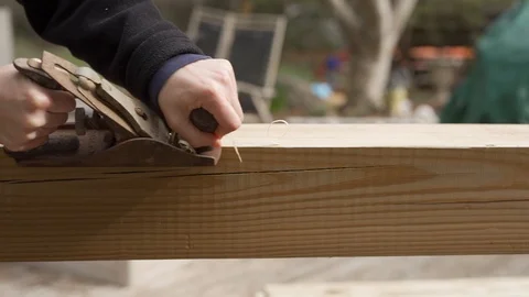 Slow motion of Man using an old wood planer Video stock 124983159