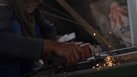 Slow motion of a man using a sander with sparkels 스톡 동영상 75887644