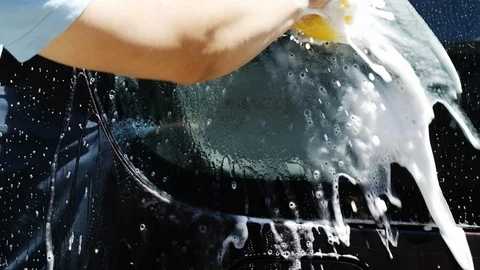 Slow motion of man washing his car 스톡 동영상 89796899