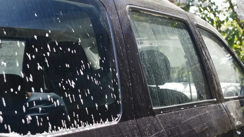 Slow motion of man washing his car Vídeos de archivo 89797343