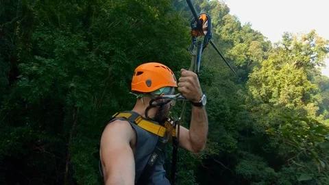 SLOW MOTION | Man on Zip-Line - POV Thailand Jungle Stock Footage 125070450