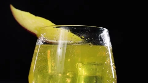 Slow motion of Mango Softdring pouring to a glass Stock Footage 146560857