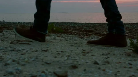 Slow motion man's footsteps toward the dawn slider shot Stock Footage 51555067