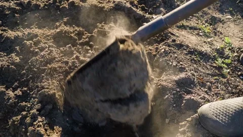 Slow motion of manual soil digging with shovel in garden bed 動画素材 343239017
