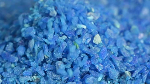Slow motion of many falling blue crystals meth salt Stock Footage 153869658