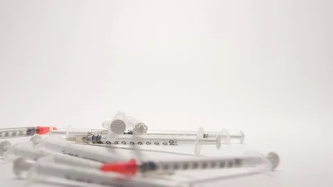 SLOW MOTION: Many syringes fall and run to a camera Stock Footage 70572662