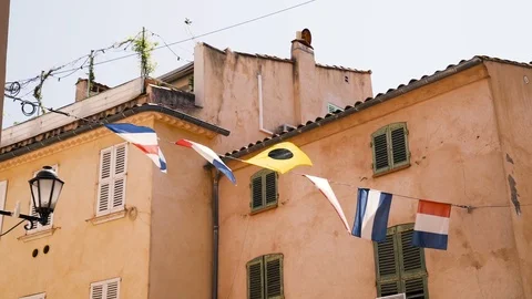 Slow motion maritime flags blowing in the wind in Saint Tropez 스톡 동영상 101650710