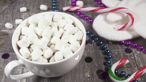 Slow motion marshmallow in a mug with a hot drink sprinkle with cinnamon Stock Footage 95852013