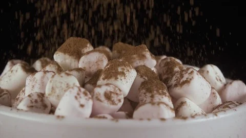 Slow motion. Marshmallow sprinkle with cocoa or cinnamon Stock Footage 75312844