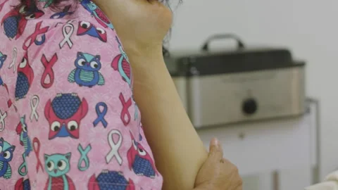 Slow motion of masseuse's hands giving a leg massage at spa Stock Footage 138061969