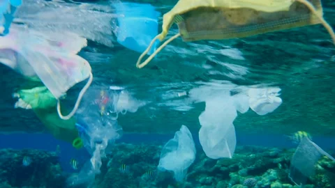 Slow motion, Massive plastic and other debris slowly drifts under surface Stock Footage 147214403