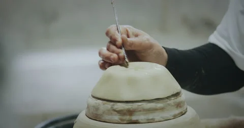 Slow motion, master potter creating ceramic products from white clay Stock Footage 203230093