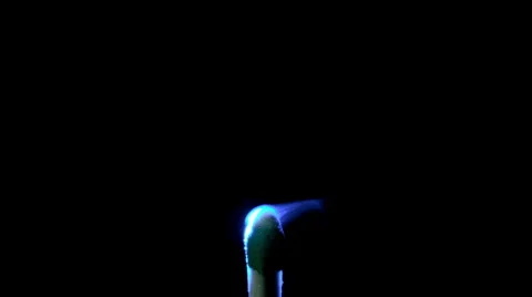 Slow motion of match lighting from blue laser pointer. Stock Footage 62342765