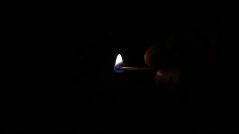 Slow motion matches burning in dark Stock Footage 156856040